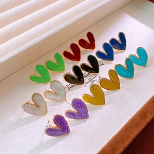 Colorful heart-shaped enamel stud earrings with gold metallic edges in multiple vibrant colors
