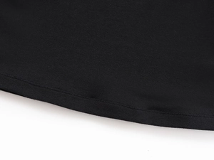 Close-up of the professional stitching and knit texture on a black U-neck athletic t-shirt