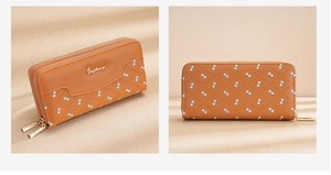 Detail of brown leather wallet featuring quilted floral pattern and dual zipper closure