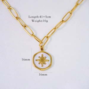 Detail of 14K gold plated paperclip chain necklace with white shell star pendant