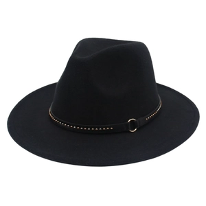 Detail of black fedora hat featuring gold rivets and metal ring on leather band