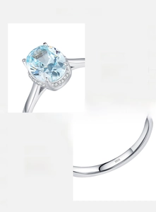 Macro detail showing S925 hallmark on silver ring with light blue oval cubic zirconia