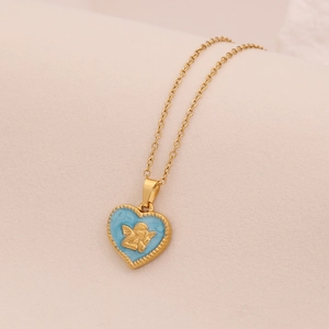 Close-up of golden heart pendant with light blue enamel and embossed angel detail