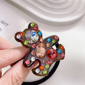 Brown tortoise shell bear hair tie with colorful rhinestones and sparkling gems