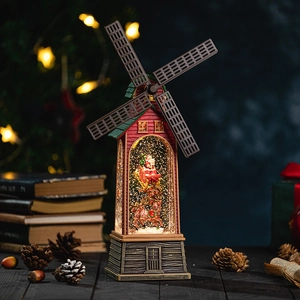 Vintage Christmas windmill music box with Santa and reindeer in a snowy crystal ball