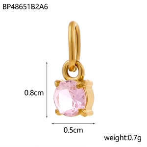 Macro shot of 0.8cm pink cubic zirconia pendant with gold claw setting and size markings
