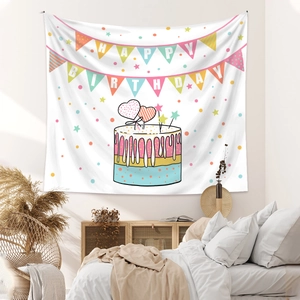 Detail of white birthday tapestry featuring colorful cake and happy birthday message