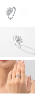 Detailed macro view of S925 silver Evil Eye ring with blue gemstone and fine engraving