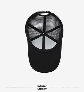 Interior view of black mesh baseball cap showing breathable lining and metal top button