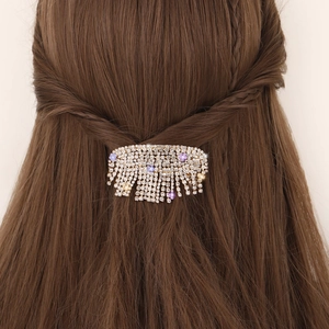 Barrette dorée étincelante avec strass, cristaux violets et franges en métal