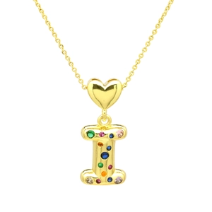 Detail of gold letter I pendant with colorful zircons on a delicate chain necklace