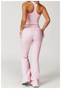 Detailed back view of pink yoga tank top and flared leggings with side drawstring