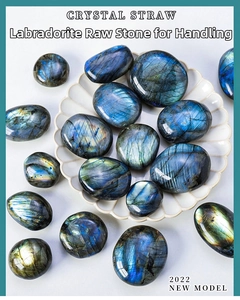 Polished labradorite crystal stones with blue flashes in a white ceramic dish