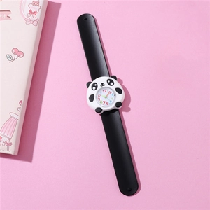 Detailed top view of a cute panda cartoon slap watch with black silicone strap on pink surface