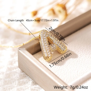 Macro view of gold-plated puffy letter A pendant with clear size and weight details