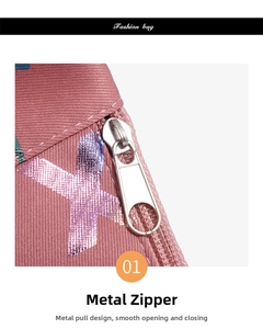 Detail of pink sports fanny pack showing a durable silver hardware zipper and fabric