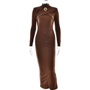 Close-up of ruched front detail with gold circular buckle on long sleeve brown maxi dress