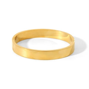 Macro shot of 18K gold plated stainless steel bangle with polished mirror finish