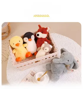 Detail view of colorful plush animal toys including duck, penguin and fox in a basket
