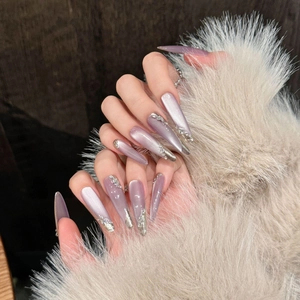 Elegant long pointed purple cat-eye press-on nails with silver embossed accents