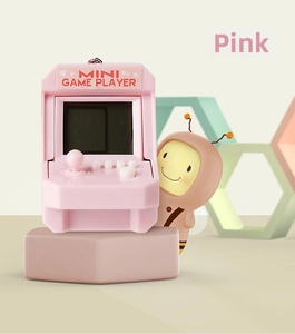 Pink mini arcade keychain with tiny joystick and buttons on a decorative pedestal