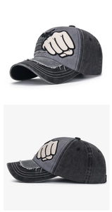 Detail of washed vintage baseball cap with large fist embroidery and Style lettering