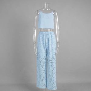 Detail of sky blue lace wide-leg pants and cropped camisole set with intricate patterns