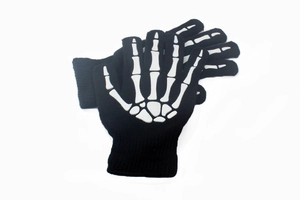 Detail of black knitted full-finger gloves with realistic white skeleton bone print