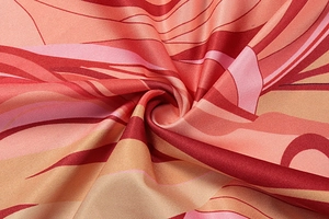 Detail shot of lightweight printed fabric showing dynamic wavy patterns and silky texture