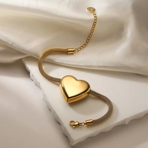 Detail shot of 18K gold plated stainless steel mesh chain bracelet with heart pendant