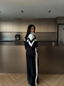 Survêtement de sport bicolore pour femme avec col zippé et pantalon large noir et blanc