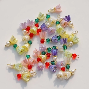 Macro detail of lily of the valley resin flower charms for DIY jewelry making