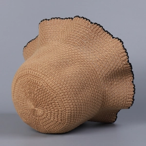 Detailed knit texture and black wavy scalloped edge of this beige summer sun hat