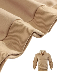 Macro shot of ribbed cuffs and warm fleece lining on a khaki half-zip sweatshirt