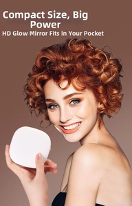 Compact LED makeup mirror held by a model to show its portable handheld size
