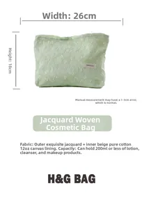 Detail view of light green jacquard makeup bag with 26x18cm size labels and cotton lining