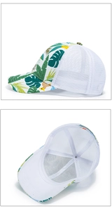 Detail showing tropical leaf print visor and breathable white mesh back on baseball cap