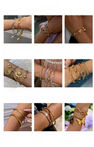 Detailed close-up of various stainless steel star and moon bracelets with 18k gold plating