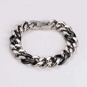 Detailed shot of two-tone hip hop Cuban chain bracelet with black and silver links