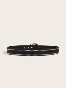 Close-up of black leather punk belt with double rows of silver studs and pin buckle