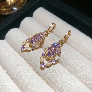 Vintage gold drop earrings with purple zircon leaf pendant and white pearl accents