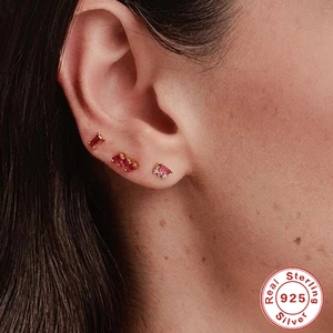 Elegant set of S925 sterling silver stud earrings with red asymmetrical zircon stones