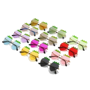 Quirky strawberry shaped sunglasses in various colors arranged in an orderly diagonal row
