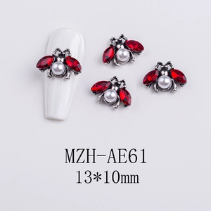Detail of red gem and pearl bee nail charms with measurements of 13x10mm for Halloween
