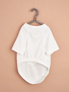 Close-up of breathable white mesh pet T-shirt featuring a heart print on a pearl hanger