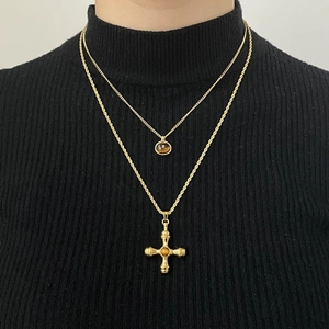 Double-layered golden stainless steel necklace featuring a cross and round coin pendant
