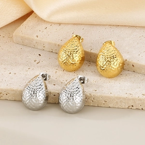 Minimalist chunky teardrop earrings in gold and silver with textured hammered finish
