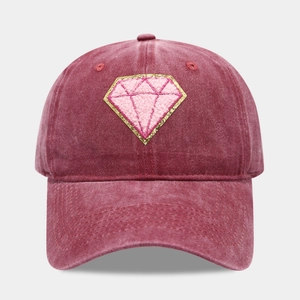 Close-up of vintage burgundy washed cotton baseball cap with pink diamond patch detail