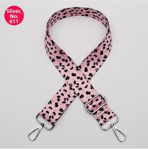 Detailed view of wide pink leopard print strap with silver metal lobster clasps