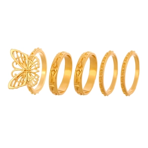 5-piece gold ring set featuring openwork butterfly design and vintage embossed patterns